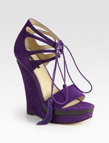 Suede platform style with a wooden insert, lace-up tassels and a unique sculpted wedge. Suede-covered wedge, 6 (150mm)Covered platform, 1½ (40mm)Compares to a 4½ heel (115mm)Suede upperLeather lining and solePadded insoleImportedOUR FIT MODEL RECOMMENDS ordering one half size up as this style runs small. 