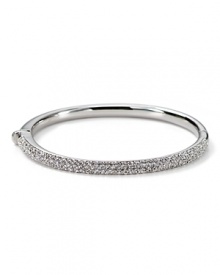 The slender bangle from Nadri is crafted in 18 Kt. gold plate with a triple-row of gleaming crystal pave to a bring a touch of light. The slender bangle from Nadri is crafted in 18 Kt. gold plate with a triple-row of gleaming crystal pave to a bring a touch of light.