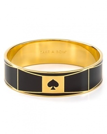 Take a bow. Slip this engraved kate spade new york bangle on your wrist to work the brand's simple take on statement style.