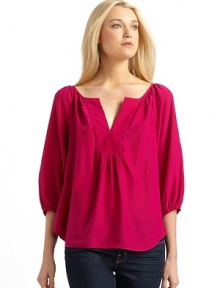 THE LOOKNotched V neckline¾ sleeves with elastic cuffsShirttail hemTHE FITAbout 22 from shoulder to hemTHE MATERIALSilkCARE & ORIGINDry cleanMade in USA THE LOOKNotched V neckline¾ sleeves with elastic cuffsShirttail hemTHE FITAbout 22 from shoulder to hemTHE MATERIALSilkCARE & ORIGINDry cleanMade in USA