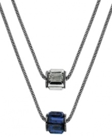 Double up. A duo of chains adorned with baguette barrels in blue and black add sophisticated style to this Kenneth Cole New York necklace. Crafted in hematite tone mixed metal. Approximate length: 16 inches + 3-inch extender. Double up. A duo of chains adorned with baguette barrels in blue and black add sophisticated style to this Kenneth Cole New York necklace. Crafted in hematite tone mixed metal. Approximate length: 16 inches + 3-inch extender.