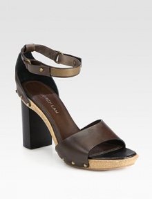 Studded leather straps surround this cork platform clog design, concluding with a secure wrap-around ankle strap. Stacked heel, 3 (75mm)Cork platform, 1 (25mm)Compares to a 2 heel (50mm)Leather upperLeather liningCork and rubber solePadded insoleMade in Italy Studded leather straps surround this cork platform clog design, concluding with a secure wrap-around ankle strap. Stacked heel, 3 (75mm)Cork platform, 1 (25mm)Compares to a 2 heel (50mm)Leather upperLeather liningCork and rubber solePadded insoleMade in Italy
