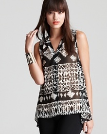 In a sheer texture, this sleeveless Aqua blouse boasts a smart tribal print for a trend-right take on a classic style. Team with streamlined skinnies and put a new spin on a go-to staple. In a sheer texture, this sleeveless Aqua blouse boasts a smart tribal print for a trend-right take on a classic style. Team with streamlined skinnies and put a new spin on a go-to staple.