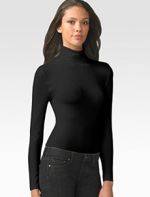 Smooth, opaque mix of Austrian cotton and nylon is finished with a cozy turtleneck that's perfect for layering. Pullover style Cotton/nylon/elastene Machine wash or dry clean Made in Austria