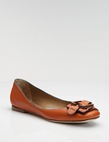 Sumptuously crafted in Italian pebbled leather, this sophisticated accent is updated with a covered-leather buckle and strap.Stacked heel, ½ (15mm) Round toe Signature-embossed strap Leather lining and sole Padded insole Made in ItalyOUR FIT MODEL RECOMMENDS ordering one half size up as this style runs small. 