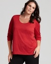 A classic scoop neck flatters the décolleté in this Eileen Fisher basic three-quarter sleeve tee--a must-have for seasonal layering.