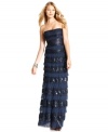 BCBGMAXAZRIA creates a captivating, statuesque evening gown using tiers of swiss dot lace, sequins and softly textured fabric.