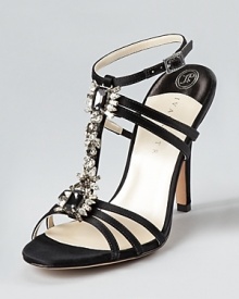 Luxurious jewels line the front of these IVANKA TRUMP evening sandals, shimmering and reflecting light with every move. Luxurious jewels line the front of these IVANKA TRUMP evening sandals, shimmering and reflecting light with every move.