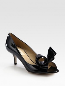 Simply divine patent leather with a kitten heel, peep toe and oversized bow adornment. Self-covered heel, 2½ (65mm)Patent leather upperLeather lining and solePadded insoleMade in Italy Simply divine patent leather with a kitten heel, peep toe and oversized bow adornment. Self-covered heel, 2½ (65mm)Patent leather upperLeather lining and solePadded insoleMade in Italy