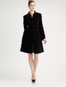 This beautifully tailored evening coat in rich velvet with satin trim has equestrian touches and a gracefully flared skirt.Satin collarNotched lapelsFitted seamed bodiceFour-button frontLong sleeves with button detail at cuffsFour front flap pocketsFlared skirtBack satin half beltBack princess seamsFully linedAbout 37 from shoulder to hemCotton/spandexDry cleanImportedSIZE & FITModel shown is 5'9 (175cm) wearing US size 4. 