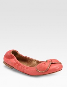 Super-soft leather design with a zipper-trimmed bow and comfortable stretch fit. Stretch leather upperZipper accented bow detailLeather lining and solePadded insoleImportedOUR FIT MODEL RECOMMENDS ordering true size. 