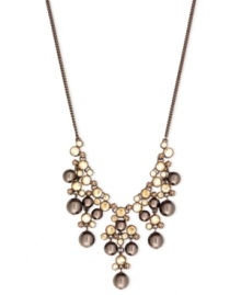 Go for the bold with this frontal drama necklace from Givenchy. Crafted from brown gold-tone mixed metal, the necklace makes a strong fashion statement with gorgeous glass pearl and cubic zirconia accents. Approximate length: 16 inches + 2-inch extender. Go for the bold with this frontal drama necklace from Givenchy. Crafted from brown gold-tone mixed metal, the necklace makes a strong fashion statement with gorgeous glass pearl and cubic zirconia accents. Approximate length: 16 inches + 2-inch extender.