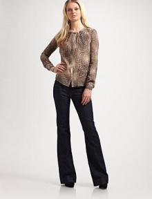 Sweet, semi-sheer jewelneck with an attached camisole and front pleating. Pleated jewelneck Long sleeves Hidden snap front Attached camisole Fully lined 96% polyester/4% spandex Dry clean Imported Sweet, semi-sheer jewelneck with an attached camisole and front pleating. Pleated jewelneck Long sleeves Hidden snap front Attached camisole Fully lined 96% polyester/4% spandex Dry clean Imported