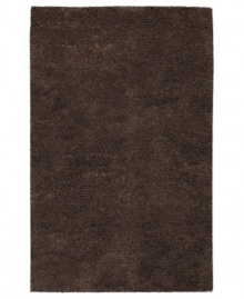 Step onto a cloud-soft area rug in chocolate brown wool. Offering one of the thickest, plushest hands in the industry, the Surya Metropolitan area rug billows with softness in every space.