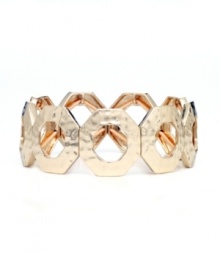 Slip shapely style over your wrist for a look of effortless elegance. Nine West's chic interlocking circles bracelet features a stretch design in gold tone mixed metal. Approximate diameter: 2-1/4 inches. Slip shapely style over your wrist for a look of effortless elegance. Nine West's chic interlocking circles bracelet features a stretch design in gold tone mixed metal. Approximate diameter: 2-1/4 inches.