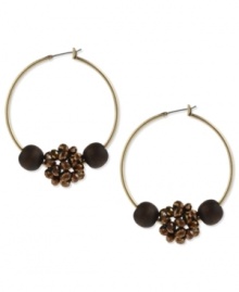 Take a walk in these nature-inspired hoops from Kenneth Cole New York. The design features brown wood and bronze tone faceted fireball beads. Crafted in gold tone mixed metal. Approximate drop: 2 inches. Take a walk in these nature-inspired hoops from Kenneth Cole New York. The design features brown wood and bronze tone faceted fireball beads. Crafted in gold tone mixed metal. Approximate drop: 2 inches.