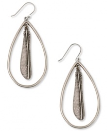 Your new fine feathered friends. These hoop earrings from Lucky Brand are styled in an oblong design with a feather pendant at the center. Crafted in silver tone mixed metal. Approximate drop: 2-1/4 inches. Your new fine feathered friends. These hoop earrings from Lucky Brand are styled in an oblong design with a feather pendant at the center. Crafted in silver tone mixed metal. Approximate drop: 2-1/4 inches.
