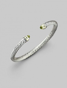 From the Color Classics Collection. The signature Yurman cable, in a graceful bangle capped with faceted peridot domes and accents of 14k gold. Peridot Sterling silver and 14k yellow gold Cable, 5mm Diameter, about 2¼ Imported From the Color Classics Collection. The signature Yurman cable, in a graceful bangle capped with faceted peridot domes and accents of 14k gold. Peridot Sterling silver and 14k yellow gold Cable, 5mm Diameter, about 2¼ Imported