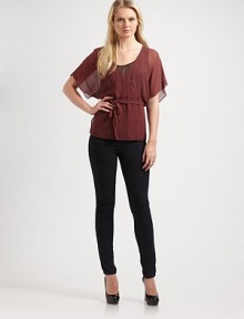 A flowing silhouette with mock wrap bodice, tie belt, and sheer dolman sleeves. V-neck with sheer underlay Tie belt About 28 from shoulder to hem Polyester Dry Clean Imported A flowing silhouette with mock wrap bodice, tie belt, and sheer dolman sleeves. V-neck with sheer underlay Tie belt About 28 from shoulder to hem Polyester Dry Clean Imported
