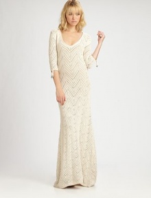 Fabulously long and lean maxi dress of crocheted cotton with beaded fringe detail on the sleeve.V-neckAbout 56 from natural waistCottonDry cleanImported Model shown is 5'9½ (176cm) wearing US size Small 