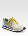 Sporty suede and leather silhouette with textured cotton-blend trim and vibrant laces. Suede and leather upperCotton-blend trimLeather liningRubber solePadded insoleImported