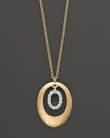 A circle of 14K. yellow gold frames a ring of diamonds. By Meira T. A circle of 14K. yellow gold frames a ring of diamonds. By Meira T.