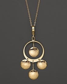 Hammered 14K yellow gold discs dance and dangle from a slim hoop. Hammered 14K yellow gold discs dance and dangle from a slim hoop.