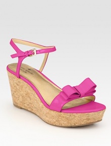 Secured by a dainty, adjustable ankle strap, this natural cork wedge features smooth patent leather straps and a bow adornment. Cork wedge, 3 (75mm)Cork platform, 1 (25mm)Compares to a 2 heel (50mm)Patent leather upperLeather liningRubber solePadded insoleImportedOUR FIT MODEL RECOMMENDS ordering one half size down as this style runs large. Secured by a dainty, adjustable ankle strap, this natural cork wedge features smooth patent leather straps and a bow adornment. Cork wedge, 3 (75mm)Cork platform, 1 (25mm)Compares to a 2 heel (50mm)Patent leather upperLeather liningRubber solePadded insoleImportedOUR FIT MODEL RECOMMENDS ordering one half size down as this style runs large.