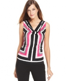 Calvin Klein goes graphic with a boldly colored striped print. The draped cowl neckline softens the look. Calvin Klein goes graphic with a boldly colored striped print. The draped cowl neckline softens the look.