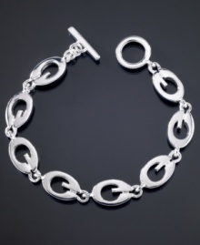 Totally trendy, this GUESS logo link bracelet goes with all of your looks. Featuring G logo links crafted in silvertone mixed metal. Approximate length: 7-1/2 inches. Totally trendy, this GUESS logo link bracelet goes with all of your looks. Featuring G logo links crafted in silvertone mixed metal. Approximate length: 7-1/2 inches.