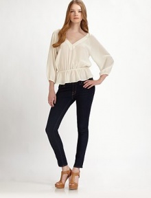 Look like an ethereal goddess in this completely feminine ruffled top made of fine silk. Wide v-neckDropped shouldersThree-quarter length sleeves with elastic band cuffsCinched elastic band waistRuffled hemV backSilkDry cleanImportedModel shown is 5'10 (177cm) wearing US size Small. Look like an ethereal goddess in this completely feminine ruffled top made of fine silk. Wide v-neckDropped shouldersThree-quarter length sleeves with elastic band cuffsCinched elastic band waistRuffled hemV backSilkDry cleanImportedModel shown is 5'10 (177cm) wearing US size Small.