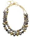 Versatility at its finest. Jones New York's trendy two-tone necklace combines two, graduated rows of silver and gold tone plastic and mixed metal beading with a toggle clasp closure. Approximate length: 17 inches + 3-inch extender.