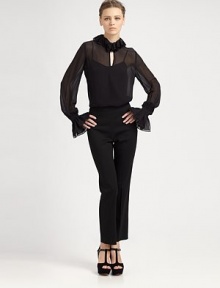Defined by a ruffle neckline and cuffs, this stunning silk blouse has a front keyhole detail and semi-sheer silhouette. Ruffle necklineFront keyhole detailLong sleeves with ruffle cuffsFully linedSilkDry cleanImportedModel shown is 5'10 (177cm) wearing US size 2. Defined by a ruffle neckline and cuffs, this stunning silk blouse has a front keyhole detail and semi-sheer silhouette. Ruffle necklineFront keyhole detailLong sleeves with ruffle cuffsFully linedSilkDry cleanImportedModel shown is 5'10 (177cm) wearing US size 2.