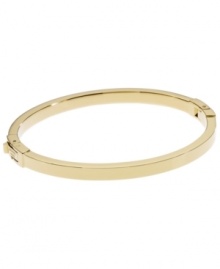 Dress up your look with a simple layer. Michael Kors thin polished bangle looks great solo, but is perfect for stacking! Crafted in gold tone mixed metal. Approximate width: 1/8 inch. Approximate diameter: 2-1/4 inches. Dress up your look with a simple layer. Michael Kors thin polished bangle looks great solo, but is perfect for stacking! Crafted in gold tone mixed metal. Approximate width: 1/8 inch. Approximate diameter: 2-1/4 inches.