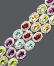 Let a rainbow of color wash over your wrist. This multistone bracelet features three rows of oval-cut garnet (6-5/8 ct. t.w.), peridot (6 ct. t.w.), citrine (4-3/4 ct. t.w.), blue topaz (6-5/8 ct. t.w.) and amethyst (6 ct. t.w.). Crafted in sterling silver. Approximate length: 7-1/2 inches. Let a rainbow of color wash over your wrist. This multistone bracelet features three rows of oval-cut garnet (6-5/8 ct. t.w.), peridot (6 ct. t.w.), citrine (4-3/4 ct. t.w.), blue topaz (6-5/8 ct. t.w.) and amethyst (6 ct. t.w.). Crafted in sterling silver. Approximate length: 7-1/2 inches.