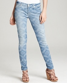These 7 For All Mankind skinny jeans are enlivened by a faded ikat print and finished with a casually cool roll-up hem. These 7 For All Mankind skinny jeans are enlivened by a faded ikat print and finished with a casually cool roll-up hem.