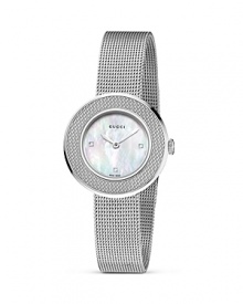 A cool mesh band lends interesting contrast against a mother of pearl face on this Gucci bracelet watch.