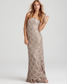 Top to toe sequins make a glittering impact on the Basix strapless gown. Top to toe sequins make a glittering impact on the Basix strapless gown.