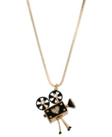 Project yourself with this necklace from Betsey Johnson. Crafted from gold-tone mixed metal and glass accents, this pendant will make sure you're ready for your closeup. Approximate length: 32 inches + 3-inch extender. Approximate drop: 2-1/4 inches. Project yourself with this necklace from Betsey Johnson. Crafted from gold-tone mixed metal and glass accents, this pendant will make sure you're ready for your closeup. Approximate length: 32 inches + 3-inch extender. Approximate drop: 2-1/4 inches.