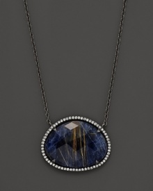 Blue sodalite pendant with quartz and diamonds on a blackened silver necklace. From Di Massima. Blue sodalite pendant with quartz and diamonds on a blackened silver necklace. From Di Massima.