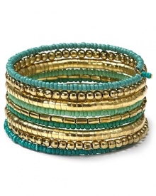 Nail this season's eclectic jewelry trend with beaded coil bracelet from Aqua. Decorated with layers of multi colored beads this colorful piece will work just as well for day as for night. Nail this season's eclectic jewelry trend with beaded coil bracelet from Aqua. Decorated with layers of multi colored beads this colorful piece will work just as well for day as for night.