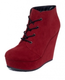 For the drama queen in all of us. Grab their attention with G by GUESS' Aleeha lace-up platform wedge shooties. For the drama queen in all of us. Grab their attention with G by GUESS' Aleeha lace-up platform wedge shooties.