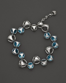 A bold sterling silver bracelet, gleaming with blue quartz , is an elegant showcase for Di MODOLO's iconic Triadra design. A bold sterling silver bracelet, gleaming with blue quartz , is an elegant showcase for Di MODOLO's iconic Triadra design.