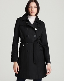 DKNY's lightweight trench is an updated classic with a plethora of pockets and a sleek silhouette. DKNY's lightweight trench is an updated classic with a plethora of pockets and a sleek silhouette.