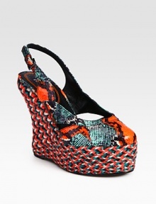 Luxe snakeskin upper with an adjustable slingback and multicolored espadrille wedge and platform. Multicolored hemp wedge, 5 (125mm)Multicolored hemp platform, 1½ (40mm)Compares to a 3½ heel (90mm)Snakeskin upperLeather lining and solePadded insoleMade in Spain Luxe snakeskin upper with an adjustable slingback and multicolored espadrille wedge and platform. Multicolored hemp wedge, 5 (125mm)Multicolored hemp platform, 1½ (40mm)Compares to a 3½ heel (90mm)Snakeskin upperLeather lining and solePadded insoleMade in Spain