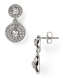 Pave-set crystals frame faceted cubic zirconia stones on these rhodium-plated earrings from Nadri. Wear this pair to take evening looks from simple to stunning. Pave-set crystals frame faceted cubic zirconia stones on these rhodium-plated earrings from Nadri. Wear this pair to take evening looks from simple to stunning.