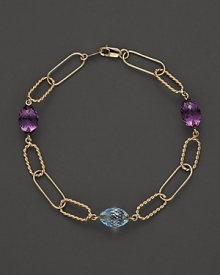 Faceted oval amethyst and blue topaz add rich sparkle to links of 14K yellow gold. By Nancy B. Faceted oval amethyst and blue topaz add rich sparkle to links of 14K yellow gold. By Nancy B.