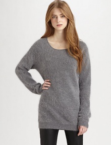 Ultra-cozy fine angora blend with an elongated hemline for superior comfort. ScoopneckDropped shouldersLong dolman sleevesRibbed trim at the neckline, cuffs and hemAbout 22 from shoulder to hem70% angora/30% nylonDry cleanImportedModel shown is 5'10 (177cm) wearing US size Small.