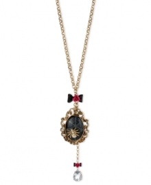 Enter Betsey Johnson's web of influence with this cameo and necklace, featuring a spider motif. Crafted from gold-tone mixed metal, the necklace features bow and flower details, a black oval locket and a teardrop glass crystal accent dangling down. Approximate length: 30 inches + 3-inch extender. Approximate drop (locket): 3-3/4 inches. Approximate drop (frontal chain): 5-1/4 inches. Enter Betsey Johnson's web of influence with this cameo and necklace, featuring a spider motif. Crafted from gold-tone mixed metal, the necklace features bow and flower details, a black oval locket and a teardrop glass crystal accent dangling down. Approximate length: 30 inches + 3-inch extender. Approximate drop (locket): 3-3/4 inches. Approximate drop (frontal chain): 5-1/4 inches.