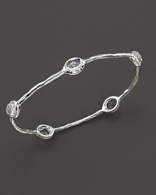 From the Silver collection, five clear quartz stations on a hammered bangle in sterling silver. Designed by Ippolita. From the Silver collection, five clear quartz stations on a hammered bangle in sterling silver. Designed by Ippolita.